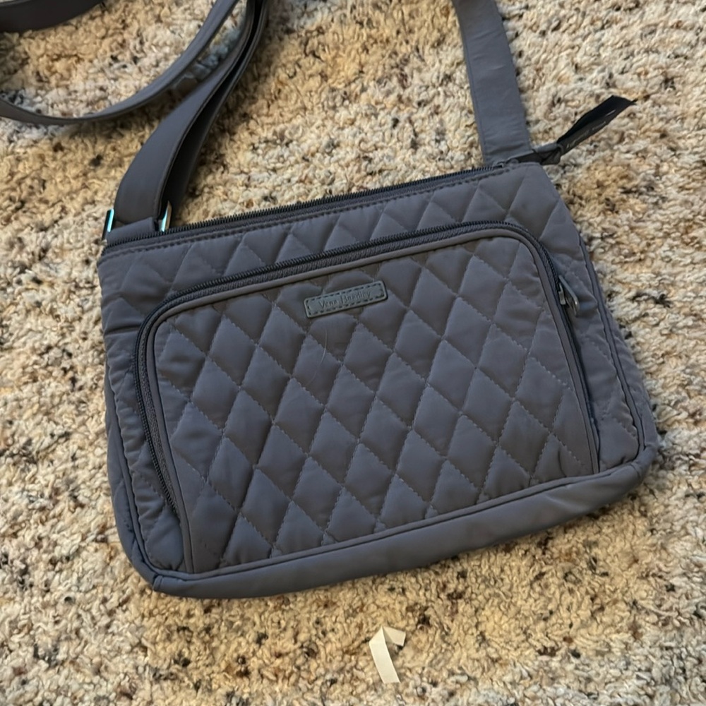 Like new gray quilted cross body zip purse.